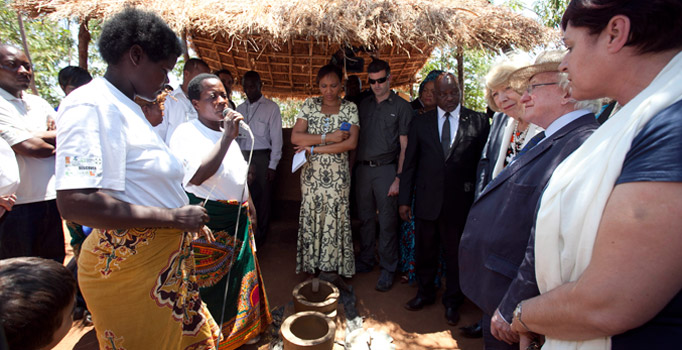 President Michael D Higgins and his wife Sabina viewing a Cook Stove Production and Utilisation Exhibition while on a visit to Saopampeni Village in the Salima District, Malawi.Photo Chris Bellew / Fennell Photography 2014