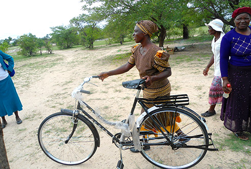 One of the caregivers receiving a bicycle for community home based care program